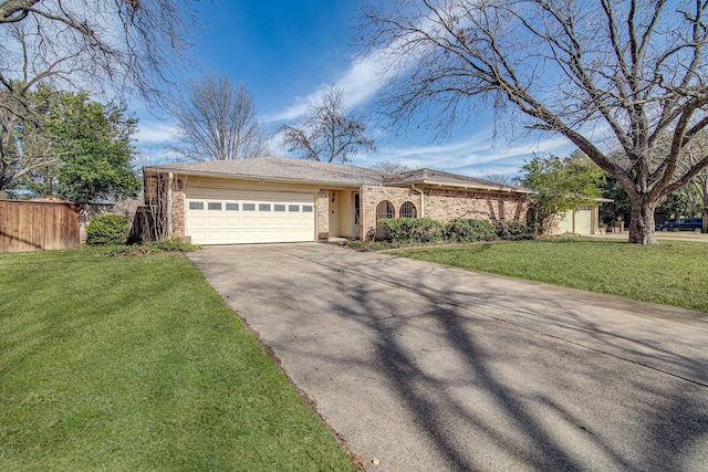 single story home featuring a front yard and a garage