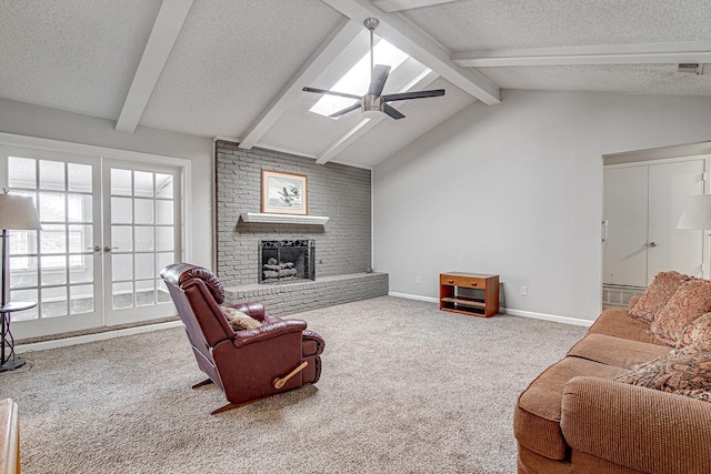 living room featuring a textured ceiling, ceiling fan, a brick fireplace, carpet floors, and lofted ceiling with beams