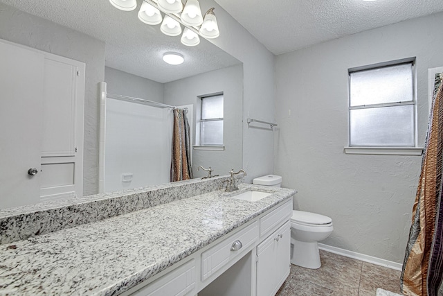 bathroom with a textured ceiling, a shower with shower curtain, vanity, and toilet