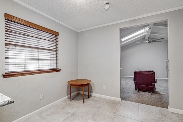 interior space featuring a textured ceiling, ceiling fan, vaulted ceiling, and crown molding