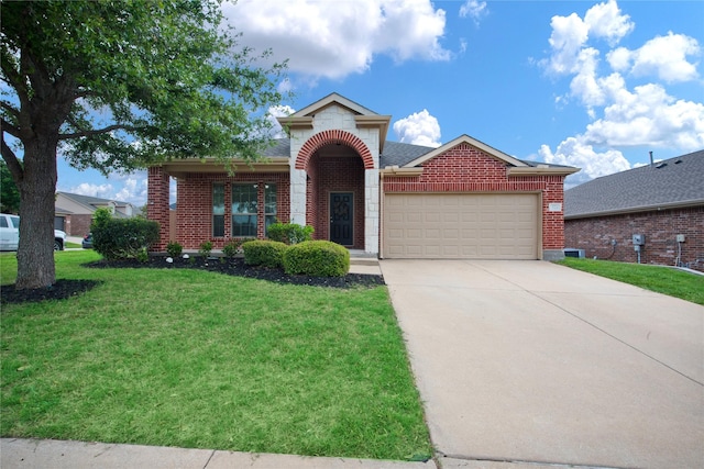 front facade featuring a front yard and a garage