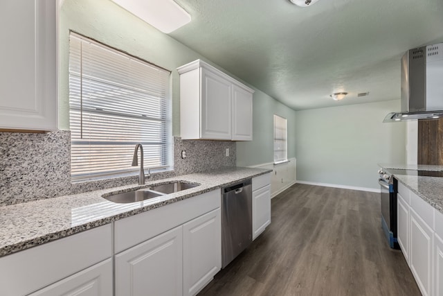 kitchen featuring stainless steel appliances, sink, white cabinets, light stone countertops, and extractor fan