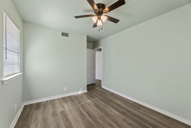 unfurnished room with ceiling fan and hardwood / wood-style flooring