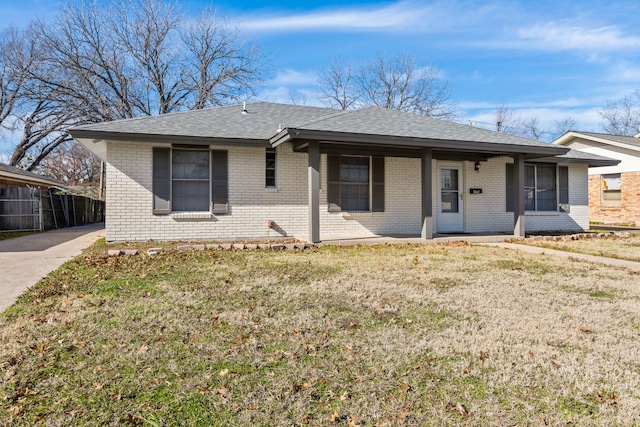 single story home with a porch and a front yard