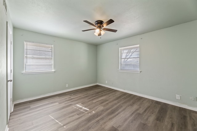 empty room featuring ceiling fan and hardwood / wood-style floors