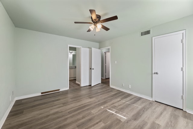 unfurnished bedroom featuring ceiling fan and hardwood / wood-style floors