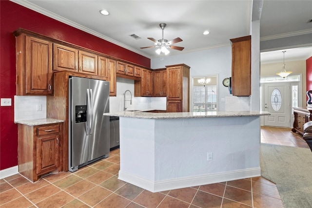 kitchen featuring visible vents, brown cabinets, a peninsula, stainless steel appliances, and crown molding