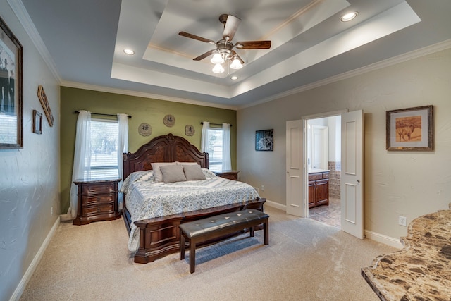 carpeted bedroom with ceiling fan, crown molding, multiple windows, and a tray ceiling