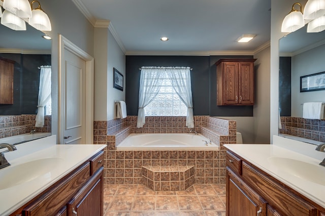 bathroom with vanity, tile patterned flooring, ornamental molding, and tiled tub