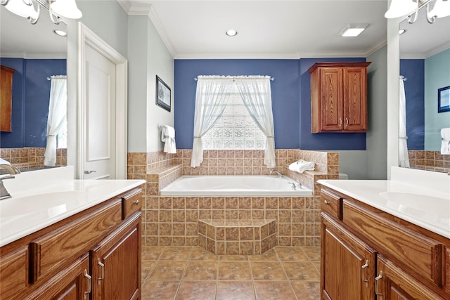 bathroom featuring ornamental molding, two vanities, and a sink