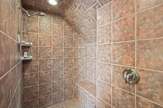 full bathroom with a tile shower and recessed lighting