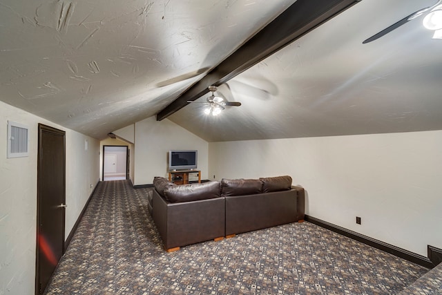 home theater with dark colored carpet, ceiling fan, lofted ceiling with beams, and baseboards