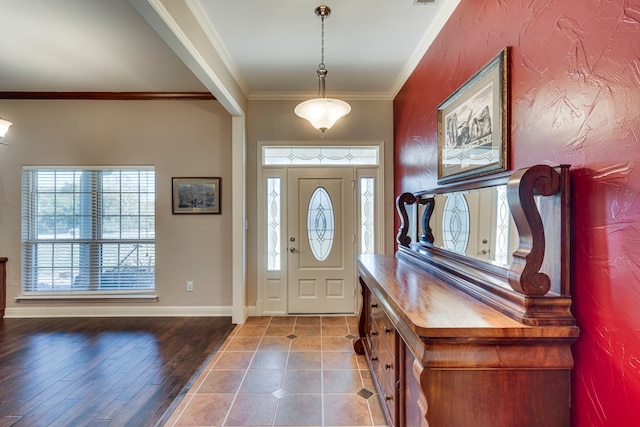 foyer entrance featuring crown molding and wood-type flooring