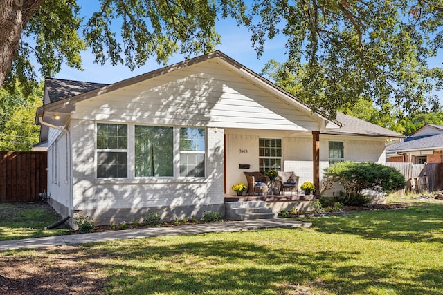 bungalow-style house with a front lawn