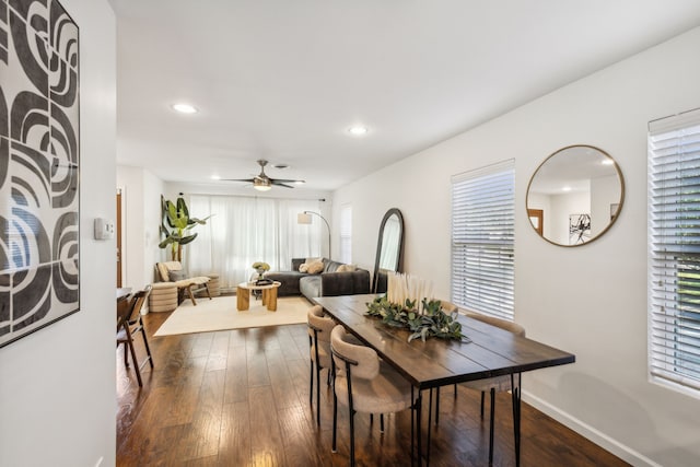 dining area featuring ceiling fan and dark hardwood / wood-style floors