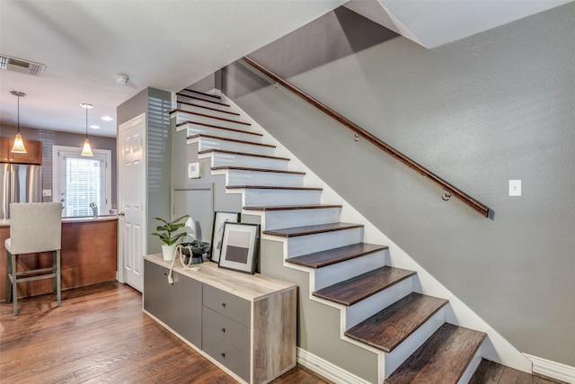 staircase featuring hardwood / wood-style floors