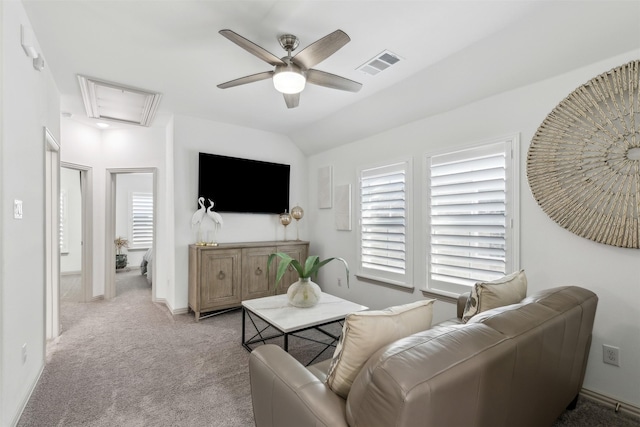 living room featuring light carpet, ceiling fan, a wealth of natural light, and lofted ceiling