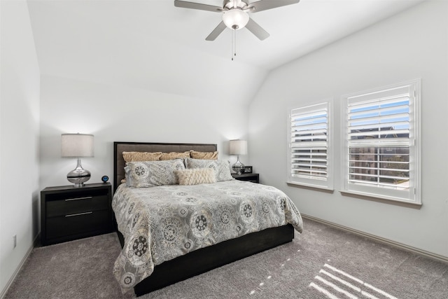 carpeted bedroom with vaulted ceiling and ceiling fan