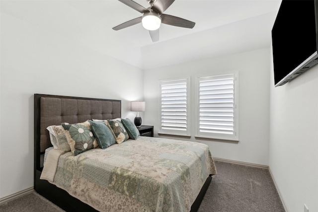 bedroom featuring ceiling fan and dark colored carpet