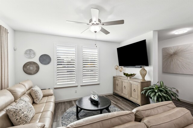 kitchen featuring a kitchen bar, white cabinetry, stainless steel appliances, an island with sink, and sink