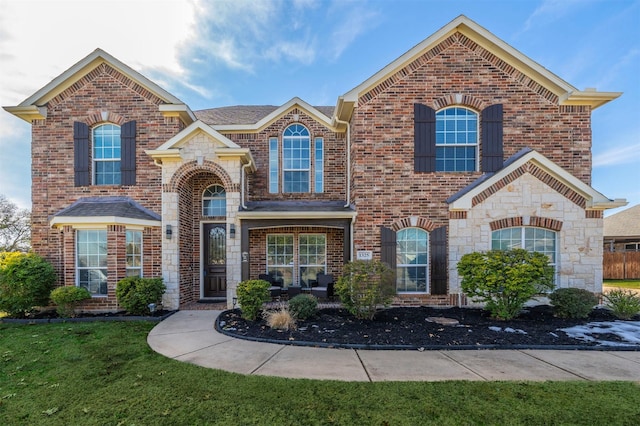 front facade with a front yard