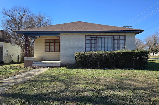 view of side of property featuring a yard