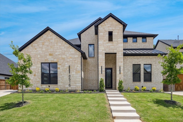 view of front of home featuring a standing seam roof and stone siding