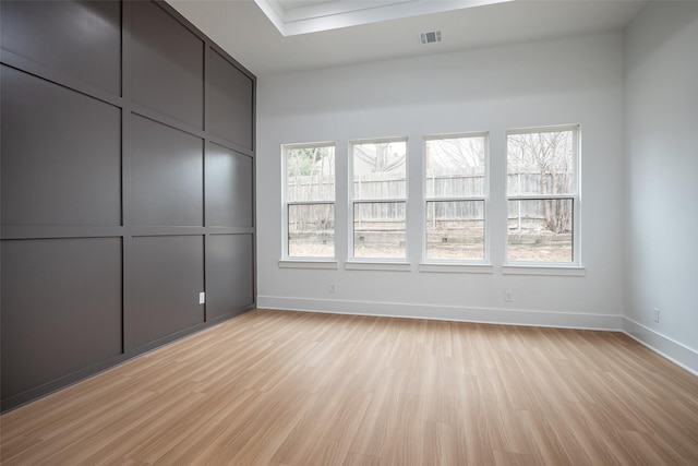 unfurnished bedroom featuring light wood-type flooring