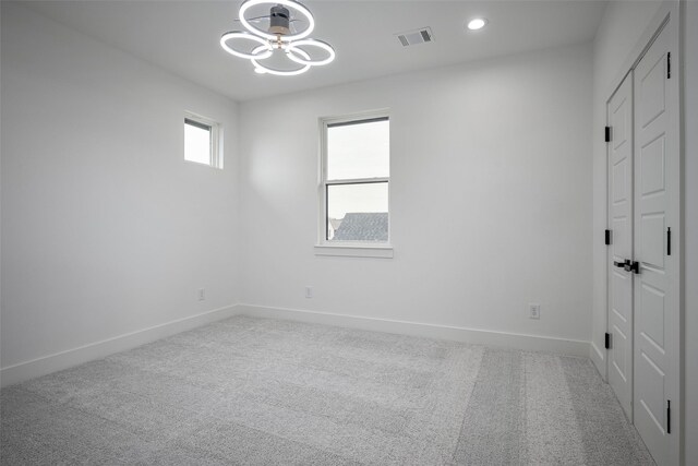 living room with a high ceiling, ceiling fan, and light wood-type flooring