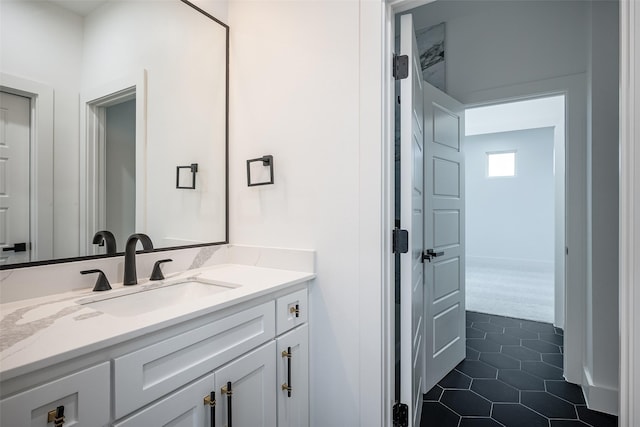 bathroom featuring tile patterned flooring and vanity