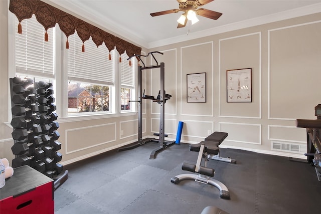 exercise room featuring ornamental molding and ceiling fan