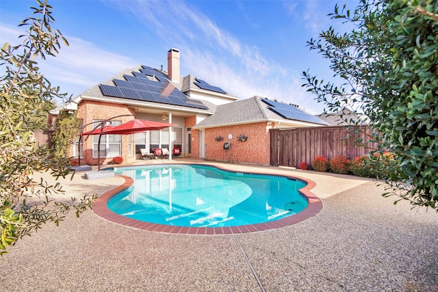 view of swimming pool featuring a fenced backyard, a fenced in pool, and a patio