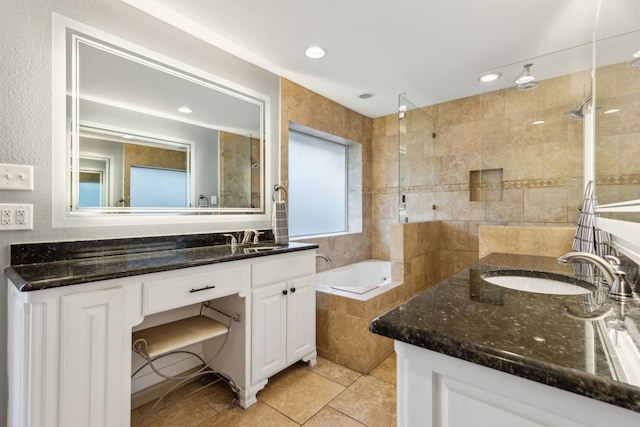 bathroom featuring vanity, tile patterned flooring, and separate shower and tub