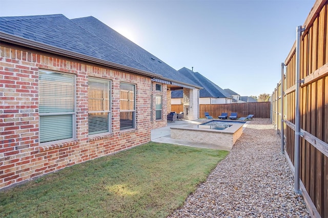 view of yard featuring a patio area and a fire pit