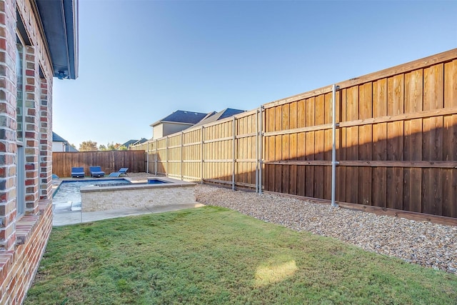 view of yard featuring a fenced backyard and a patio