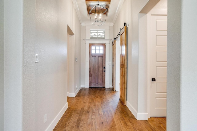 unfurnished room featuring ceiling fan, crown molding, and light wood-type flooring