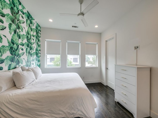 bedroom featuring ceiling fan and dark hardwood / wood-style floors