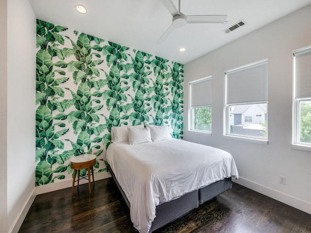 bedroom featuring ceiling fan and dark hardwood / wood-style flooring