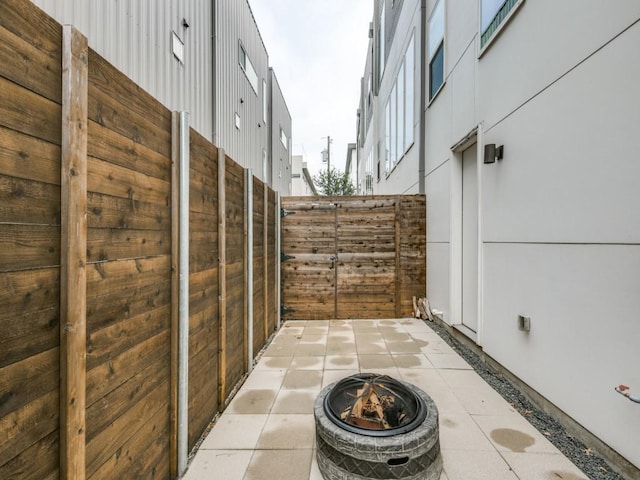 view of patio / terrace with a fire pit