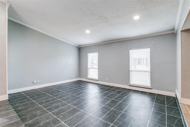 empty room featuring a textured ceiling and crown molding