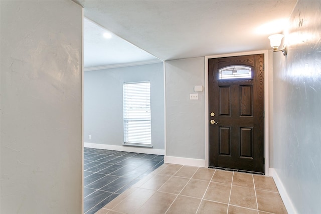 foyer featuring ornamental molding