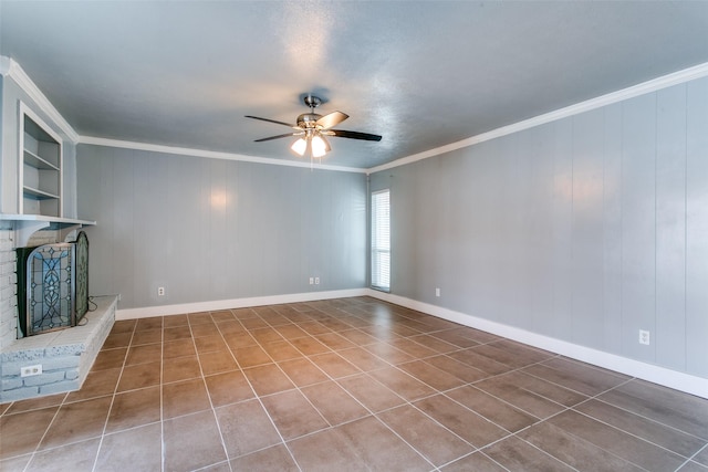 unfurnished living room featuring ceiling fan, a fireplace, tile patterned floors, and crown molding