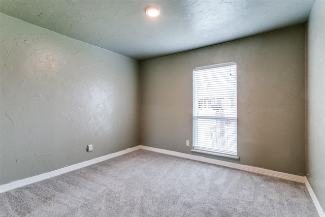 unfurnished room featuring carpet floors