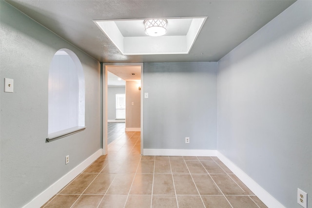 interior space with a tray ceiling