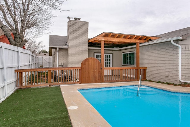 view of swimming pool with a wooden deck