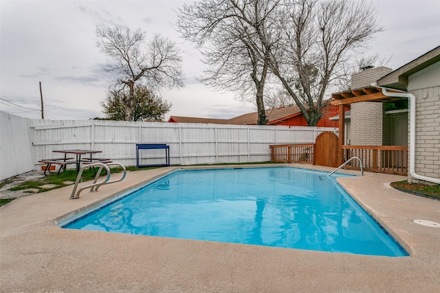 view of swimming pool with a patio area