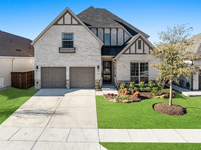 view of front of house with a front yard and a garage