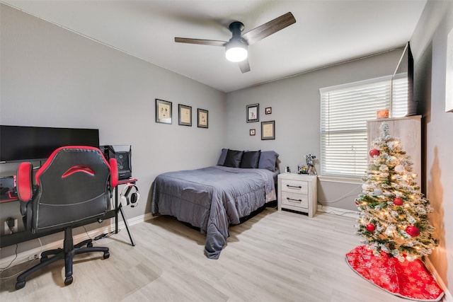 bedroom featuring ceiling fan and light wood-type flooring