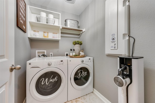 clothes washing area featuring washing machine and clothes dryer