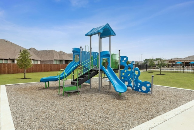 view of jungle gym with a lawn